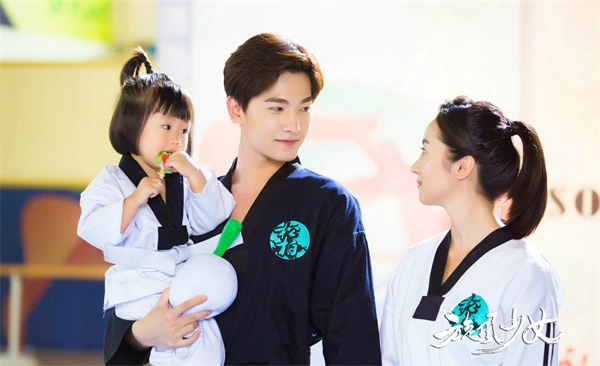 Tornado Girl 2: Family in uniforms, warm and sporty scene.