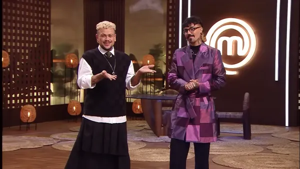 Hosts of "MasterChef Creators" engaging on the show's stage.