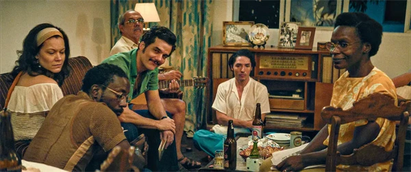 A secret agent joins a warm indoor gathering with friends.
