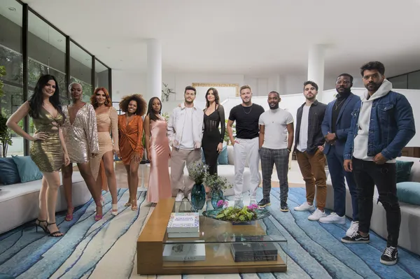 Cast of "Love Is Blind Brazil" gather in a stylish living room.