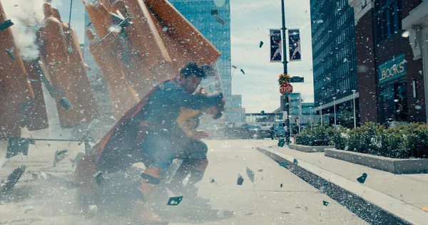 Superman engages in a fierce battle in a city in "Superman (2025)".