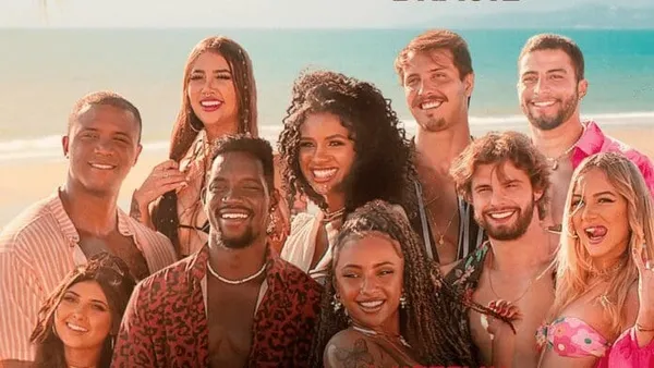 Cast of "Too Hot to Handle: Brazil" smiles together by the seaside.