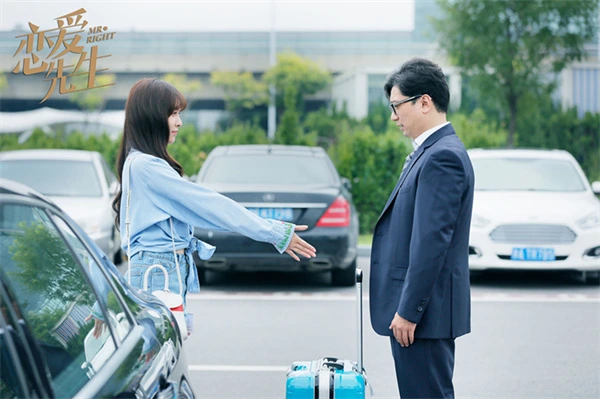 Man and woman interacting in parking lot from Mr. Love